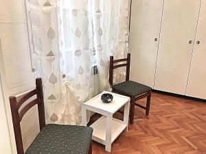 a room with a table and two chairs and a table at ORTHOPEDIC CENTER NEAR WITH FREE PARKING, Quite and Privately in Lovran