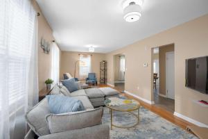 a living room with a couch and a tv at Tusculum Hilltop Haven For 8 in Cincinnati +23 photos