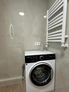 a washing machine in a room with a window at ЖК Сонячна Тераса in Ternopil