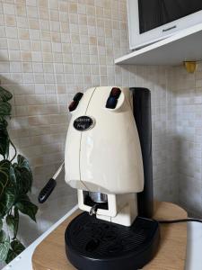 a white coffee machine sitting on a counter at B&B La Meta in Benevento +70 photos