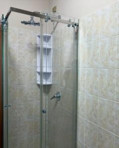 a shower with a glass door in a bathroom at Maison della Presolana in Songavazzo +9 photos