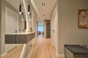 a kitchen with a large sink and a hallway at BSY Flats Well Decorated Modern Apartments With 2BR, 3BR Options in Istanbul +84 photos