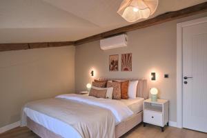 a bedroom with a bed with white sheets and pillows at BSY Flats Well Decorated Modern Apartments With 2BR, 3BR Options in Istanbul