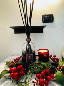 a bottle of wine and a candle on a table at B&B La Meta in Benevento