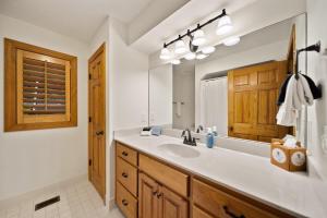 a bathroom with a sink and a mirror at Chetola: Sierra 1 in Blowing Rock +19 photos