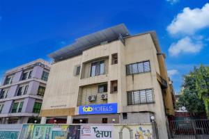 a building with a blue sign on it at Via Blissful Stays in Mumbai