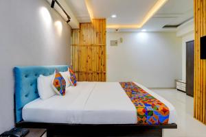 a bedroom with a large bed in a room at Via Blissful Stays in Mumbai