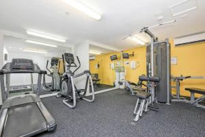 a gym with several treadmills and exercise bikes at Darwin Central Escape Hotel Style Apartment with Kitchen , Pool , Gym , Car Park,Balconey in Darwin