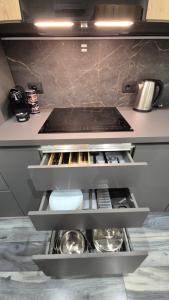 a kitchen with a counter with a toilet in it at Anzio Central Apartments in Anzio