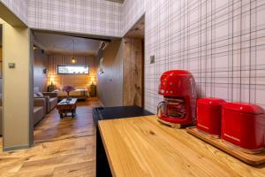 a kitchen with a red appliance on a counter at Positano Apartment in Głowno
