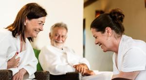 two women and a man sitting at a table at The Mayfair Suites by AURACHE in Greater Noida +64 photos