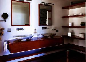 a bathroom with two sinks on a counter at Tropical heaven in Les Trois-Îlets +3 photos