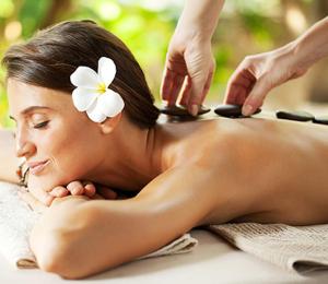 a woman getting her hair washed at a spa at The Mayfair Suites by AURACHE in Greater Noida