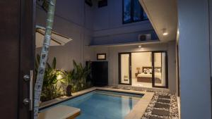 a swimming pool in the middle of a house at 3BR Private Pool Villa in Central Seminyak - Walk to Cafés & Shops in Seminyak