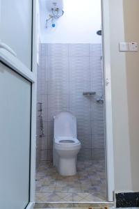 a bathroom with a toilet and a shower at Sastar Homes in Iringa +14 photos