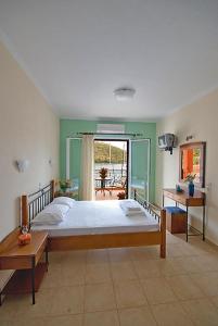 Un pat sau paturi într-o cameră la Asterida