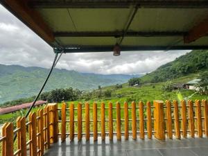 a view from a balcony of a mountain view at MaMa ShuShu Homestay in Sapa