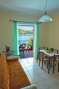 a living room with a couch and a table at Asterida in Sivota