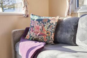 a pillow sitting on a couch in a room at Host and Stay - 421 Wooler Park in Wooler