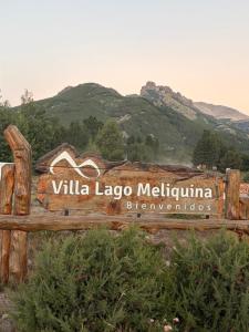 a sign for the valley lagoco malibu sign with mountains in the background at Cabañas Betsaida in Lago Meliquina +3 photos