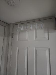 a white closet with a door and a window at Bridgeport East Main in Bridgeport