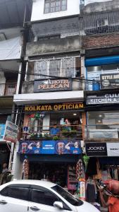 a white car parked in front of a building at Hotel Pelican in Kalimpong