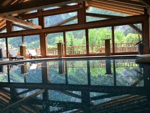 The swimming pool at or near Au Coeur Des Neiges & SPA