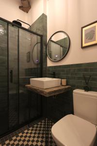 a bathroom with a sink and a mirror and a toilet at Lock Keepers Cottage at Salterhebble in Exley +15 photos