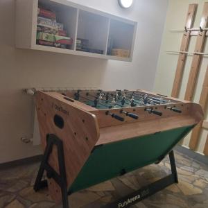 a wooden foosball table in a room at U Gumisia in Korbielów