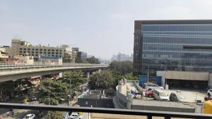 a city with cars parked in a parking lot at Dream Inn in Bangalore