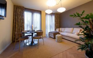 a living room with a couch and a table at Gelk in Groningen +23 photos