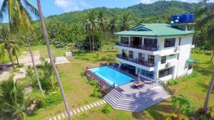 an aerial view of a house with a swimming pool at Anapuro Elnido in El Nido