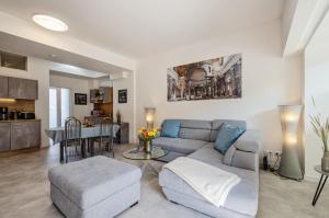 a living room with a couch and a table at Prora - Wohnung mit Terrasse - Proras Strandhaus in Binz