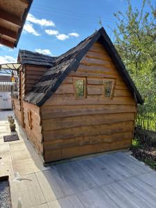 a log cabin with a pitched roof at La cabane enchantée in Hudiviller +7 photos