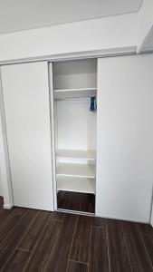 an empty closet with a desk in a room at Turek Residences in Ushuaia