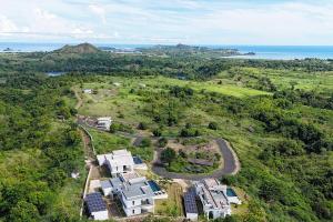 an aerial view of a house with solar panels at Passot Hills - Villas Premium in Nosy Be +157 photos