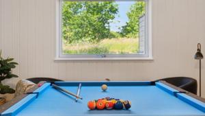 a blue pool table with a ball on it at Villavilla 640 - Saksild, Østjylland in Odder