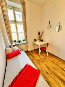 a living room with a couch and a table at Pokój przy Rynku ll in Katowice