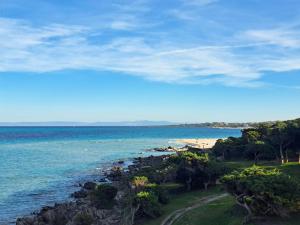 a view of the ocean and a beach at Residenza Ponente in Stintino