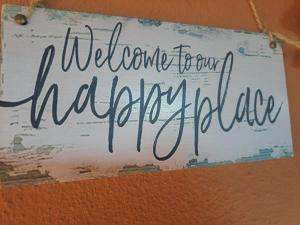 a sign that reads welcome to our anchorage hospital at Residenza Ponente in Stintino