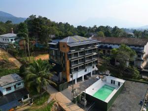 an overhead view of a building with a swimming pool at Rasha Suites in Kalpetta