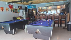 two pool tables in a room with a bar at Robert's Place Paarl in Paarl