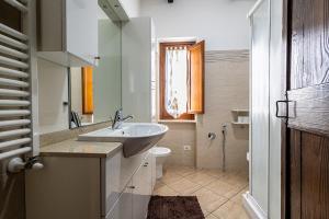 a bathroom with a sink and a toilet at Maison de Marino - B&Brother's rome in Marino +25 photos