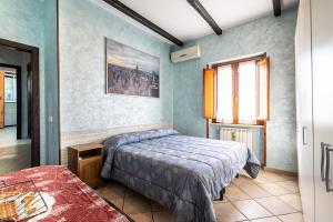 a bedroom with two beds and a window at Maison de Marino - B&Brother's rome in Marino