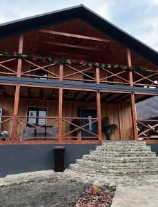 a large building with stairs in front of it at mountain house in Skhidnitsa