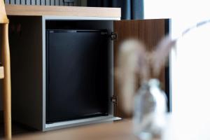 a bottle of water sitting next to a television at Silver Bay Club House in Urla +53 photos