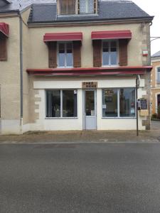 a store on the side of a street at les chambres de Mémé in Bonnat