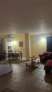 a living room with a couch and a table at Dimora Villa Luna 22 in Policoro