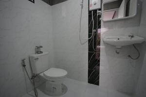 a bathroom with a toilet and a sink at Krabi Aonang happy resort in Ao Nam Mao