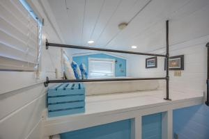 a room with a bench and a mirror in a boat at Matlacha Tiny Village in Matlacha +34 photos